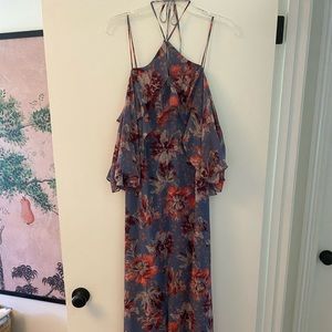 Floral maxi dress with slit up the front, halter tie, and flutter sleeves